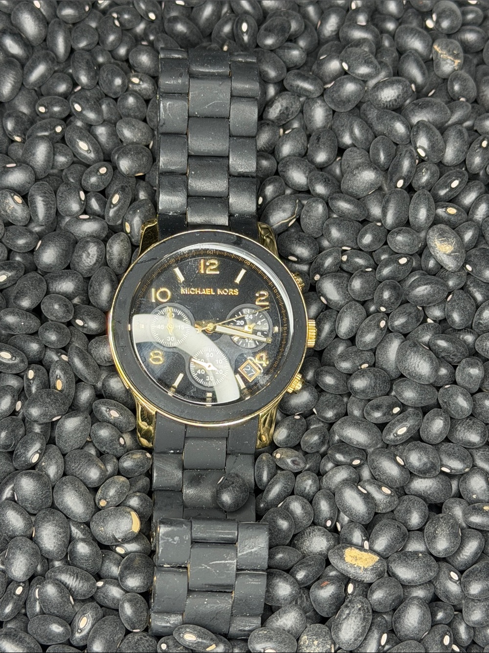 Michael Kors Black and Gold Chronograph Watch needs battery